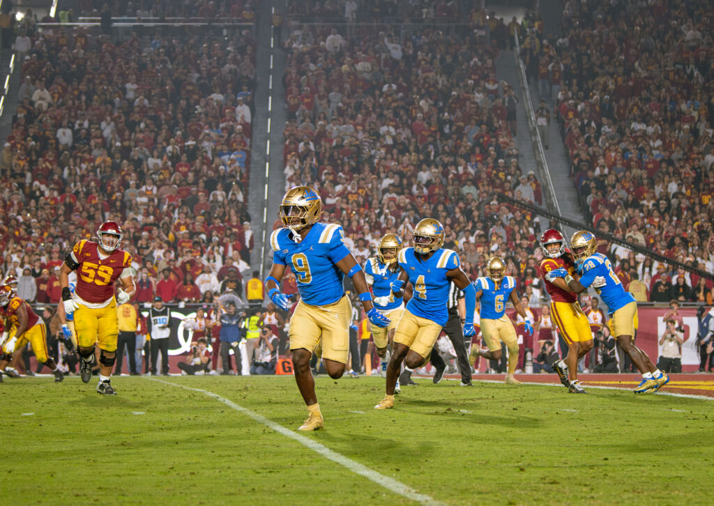 The Bruins' defense celebrates after a crucial stop. Photographed by Catherine Rodriguez/BruinLife.