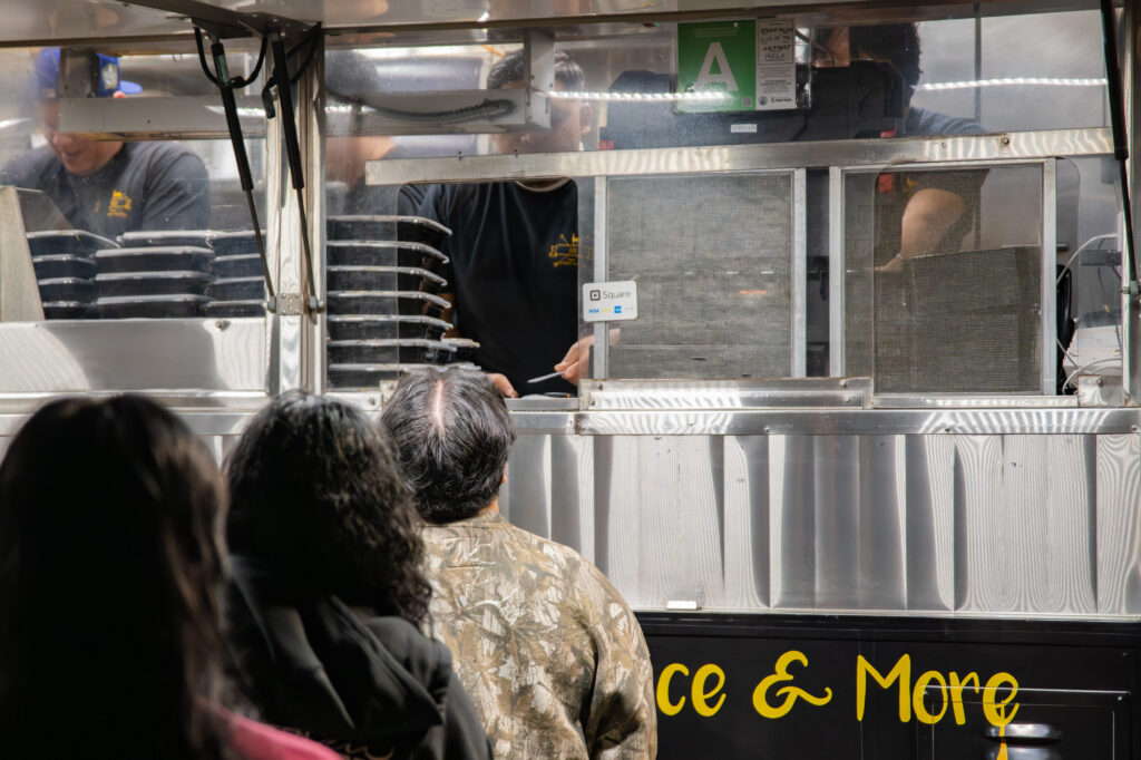 Students waiting in line for the 8E8 Thai food truck as they use their meal plans to purchase a meal. The truck was particularly busy late at night as students opted for street food over the dining halls. Photographed by Siena Hunt/BruinLife