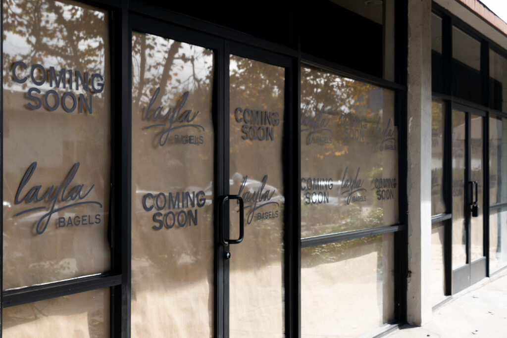 'Coming Soon' graphics stretch across the new location of Layla Bagels. Photographed by Aamani Maddukuri/BruinLife.