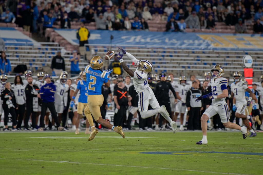 #2, Titus Mokia-Atimalala, attempts to catch a pass from quarterback Nico Iamaleava. This incomplete pass was one of many in the Bruin loss to Washington. Photographed by Regan Rhodes/BruinLife.