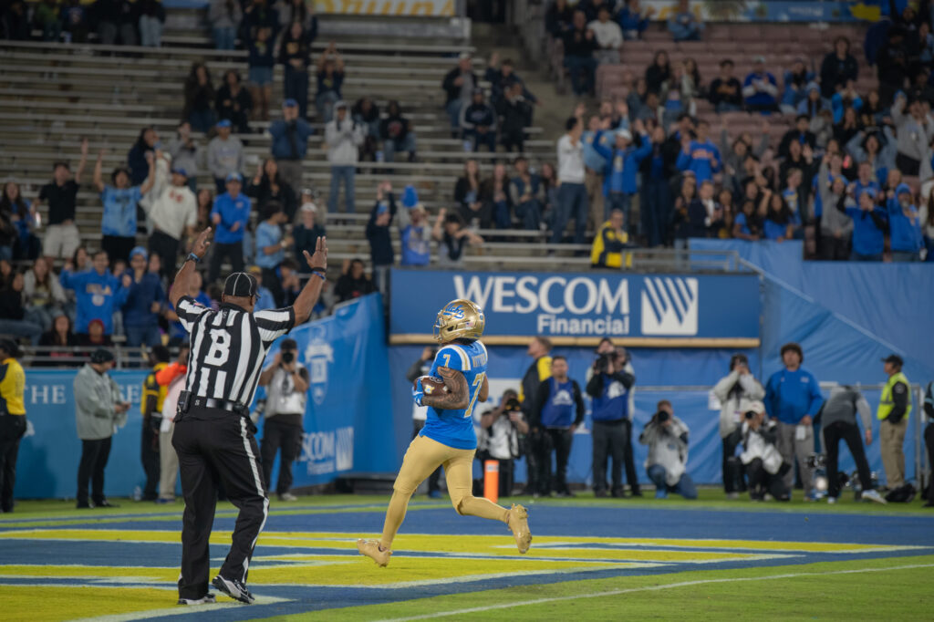 Wide receiver, Mikey Matthews, scores a touchdown for the Bruins at the end of the third quarter. Matthews played a huge part of the Bruin offense against the Huskies. Photographed by Regan Rhodes/BruinLife.