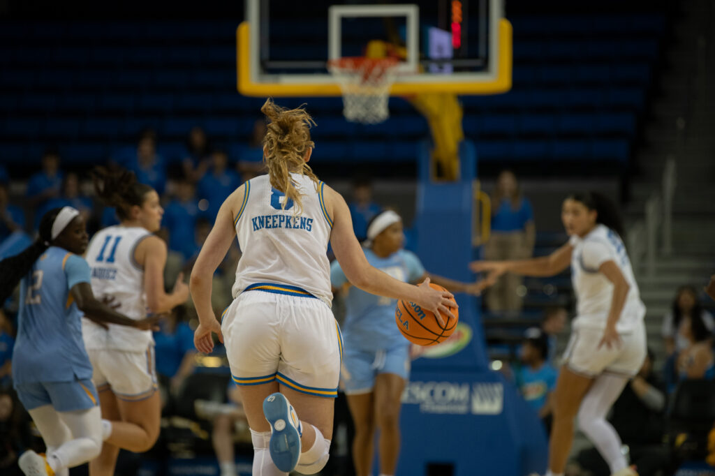 #8 Gianna Kneepkens dribbles down the court in the Bruin match up against Southern University. Kneepkens went on to score six points in 16 minutes, contributing to the Bruins' dominant win over the Jaguars. Photographed by Regan Rhodes/BruinLife.