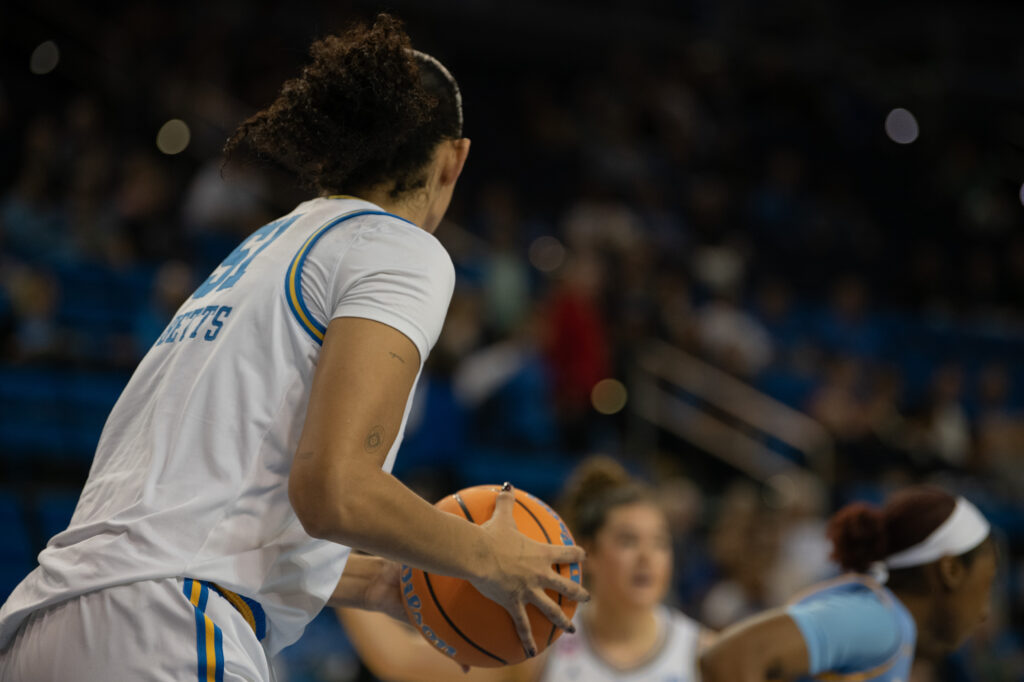#51 Lauren Betts gets the defensive rebound after a failed layup by the Jaguars. The senior center had an impressive performance all around in the game against Southern University. Photographed by Regan Rhodes/BruinLife