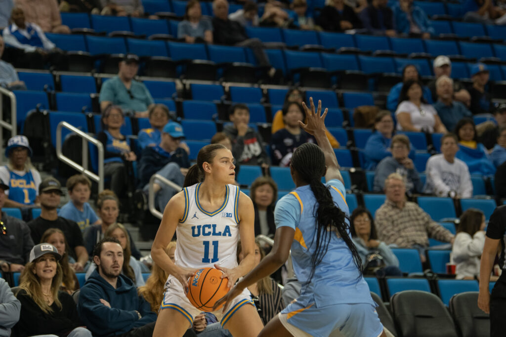 Senior guard Gabriela Jaquez looks for a teammate to pass to in the second quarter. Jaquez scored her 1000th career point in the Bruins' game against Southern University. Photographed by Regan Rhodes/BruinLife