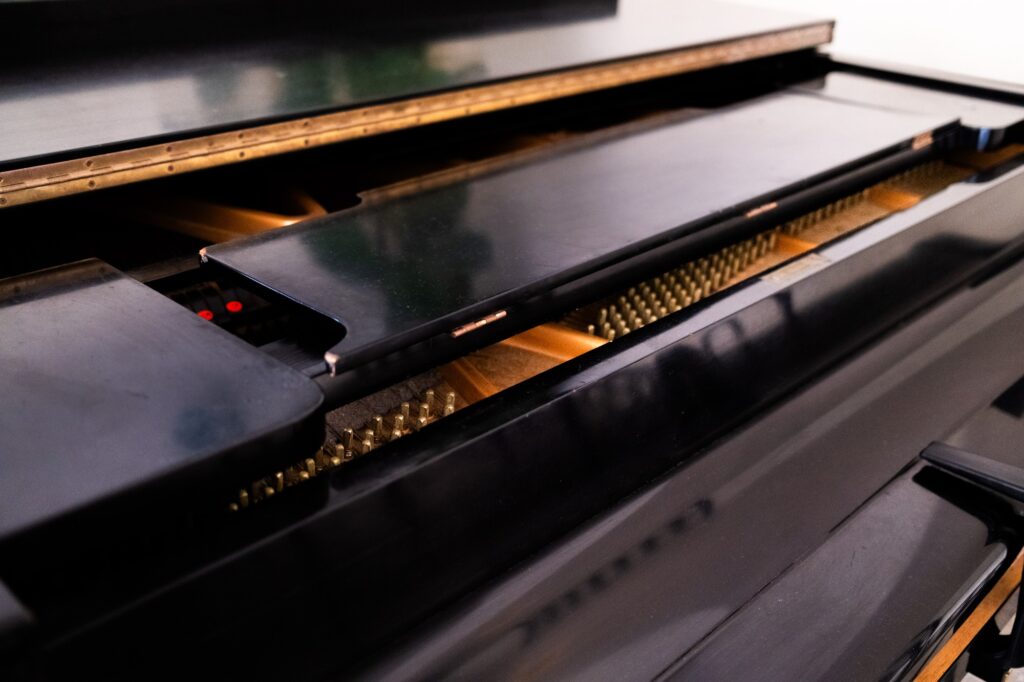 Close-up of the Covel Commons Piano. Despite its popularity and heavy use, all of its keys and pegs remain intact. Photographed by Catherine Rodriguez/BruinLife.