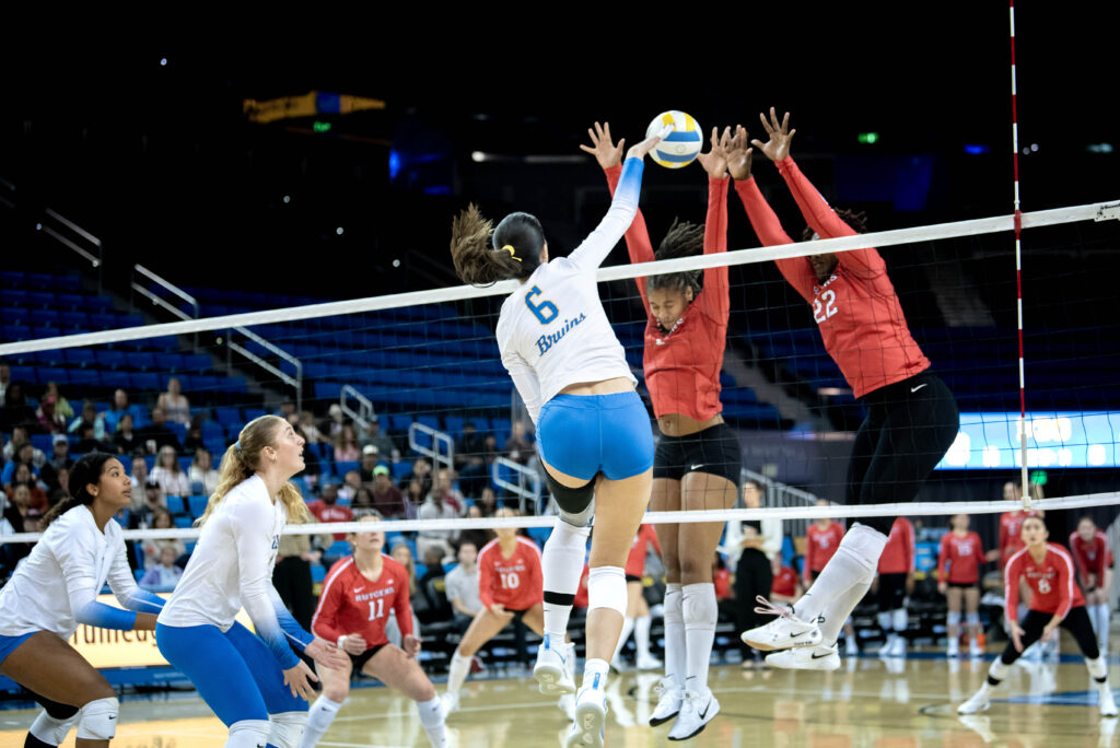 Anastasija Ivkovic finds an opening between the defenders' hands. Her teammates watch as she attempts to score. Photographed by Janwayne Orme/BruinLife.