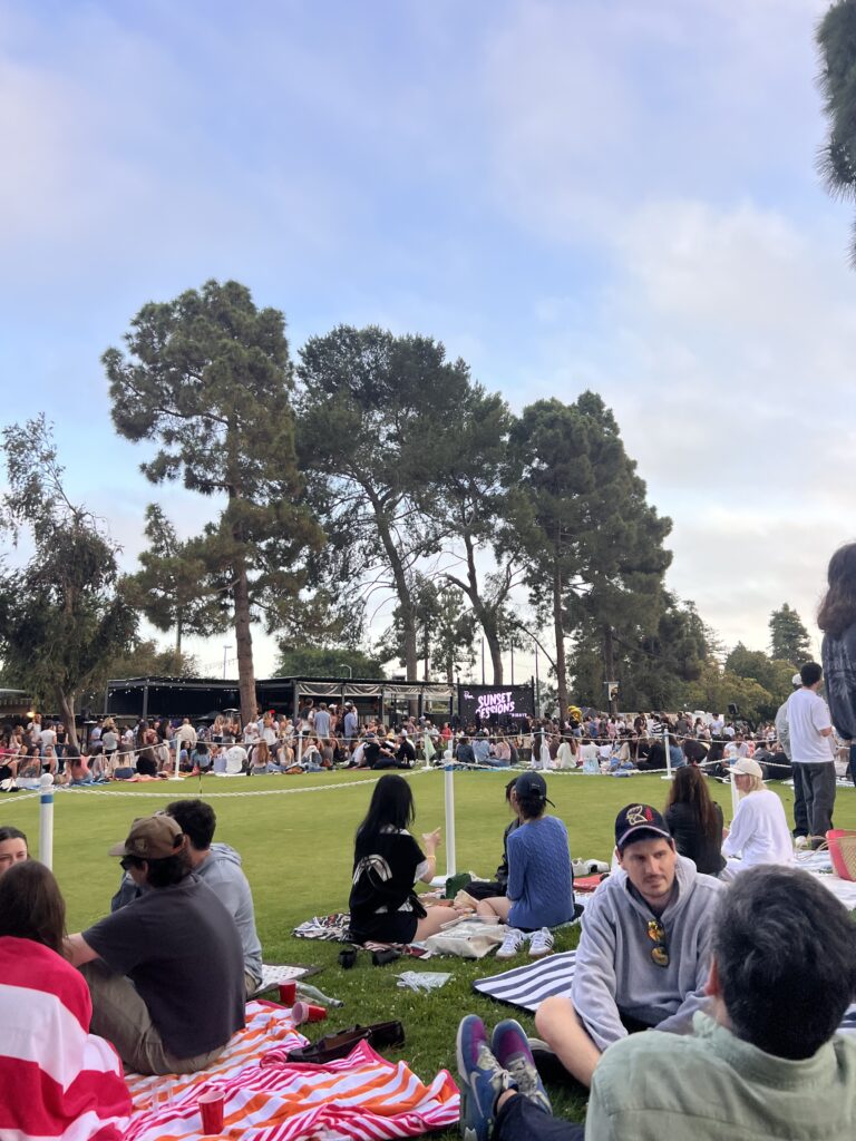 Visitors watch the Venice sunset on a warm spring day. The event begins with a mingling hour, before bringing out the live band to perform. Photographed by Leah Aviram/BruinLife