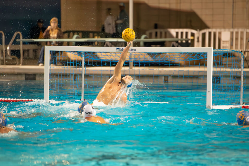 Nate Tauscher deflects an incoming shot from the opposing side. The save keeps UCLA's lead over the opposing team. Photographed by Janwayne Orme/Bruin Life.