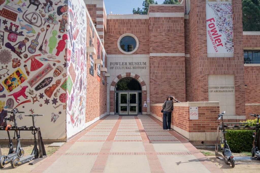 Two students stand outside of UCLA&squot;s Fowler Museum. The museum was the location of a recent Los Angeles Times Food Bowl screening and discussion of "Field Trip: Hong Kong." Photographed by Regan Rhodes/BruinLife