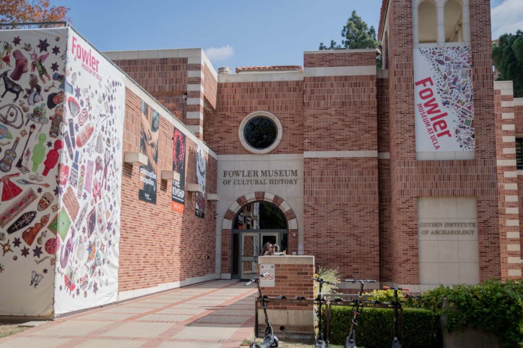 Two students stand outside of UCLA&squot;s Fowler Museum of Cultural History. The museum hosted a recent Los Angeles Times Food Bowl screening and discussion of "Field Trip: Hong Kong" presented by chefs Curtis Stone and Vicky Cheng. Photographed by Regan Rhodes/BruinLife.