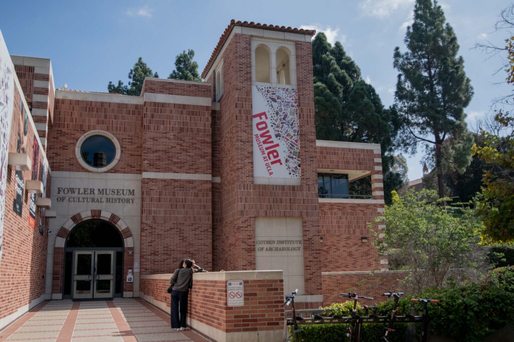 Two students stand outside of UCLA&squot;s Fowler Museum of Cultural History. The museum hosted a recent Los Angeles Times Food Bowl screening and discussion of "Field Trip: Hong Kong" presented by chefs Curtis Stone and Vicky Cheng. Photographed by Regan Rhodes/BruinLife.