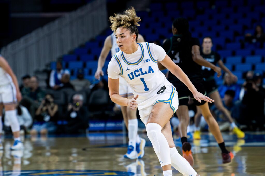 Guard Kiki Rice races across the court as the Bruins gain possession of the ball. Rice would go on to score 23 points, nearly as many as the entire Cal Poly team combined. Photographed by Asher Nee/BruinLife.