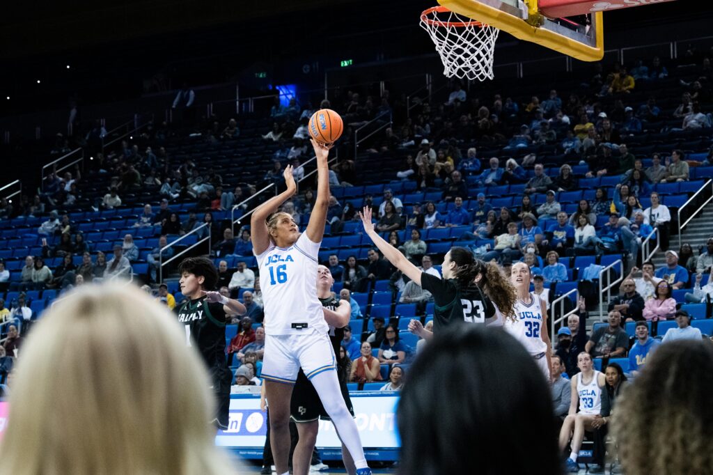 Rising star Sienna Betts takes a shot in the final seconds of the third quarter. Sienna Betts and her sister Lauren Betts made for a formidable duo on the court. Photographed by Asher Nee/BruinLife.