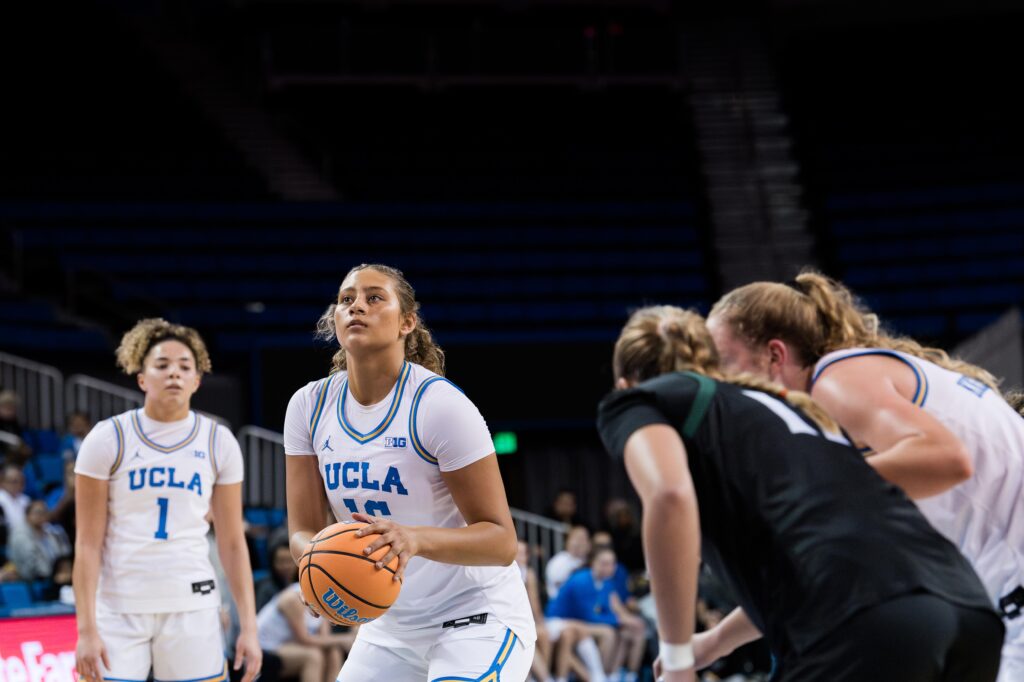 Forward Sienna Betts prepares to shoot a free throw. Betts pulled no punches in her first game for the Bruins post-injury, proving a formidable force on the court. Photographed by Asher Nee/BruinLife.