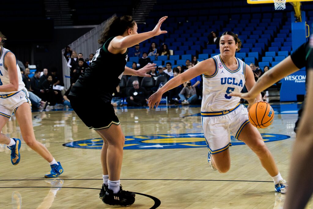 Guard Charlisse Leger-Walker careens past Cal Poly defenses on her way to a layup. Leger-Walker missed the shot, but went on to score 14 points for the Bruins. Photographed by Asher Nee/BruinLife.