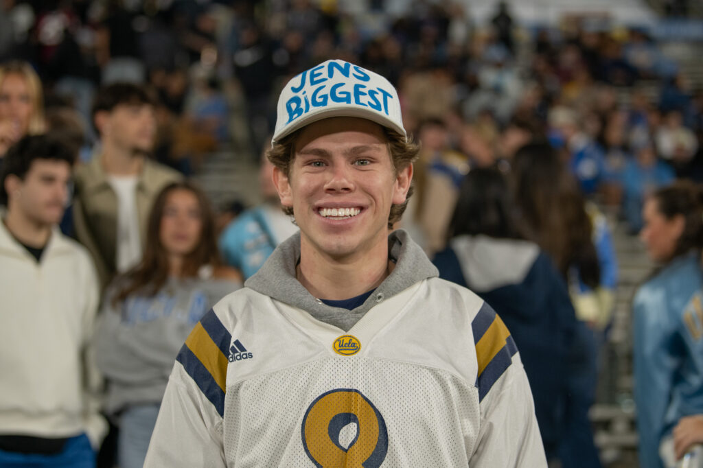 Senior Business Economics student Kevin Forbath reps a vintage UCLA jersey and a hat that says, "Jen&squot;s Biggest Fan." Forbath was not only supporting the Bruins, but also his friend Jen Arantes who is the captain of UCLA&squot;s dance team. Photographed by Regan Rhodes/BruinLife.