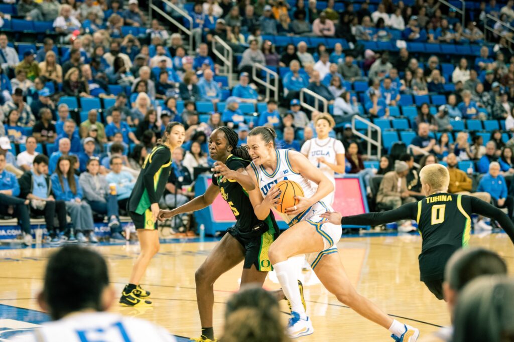 Forward Angela Dugalić charges with the basketball.