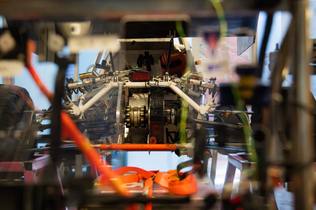 The car's core interior is pictured exposed, showing the motor and different units mid-construction. The Bruin Formula Racing team worked to compile and design the car from scratch. Photographed by Siena Hunt/BruinLife