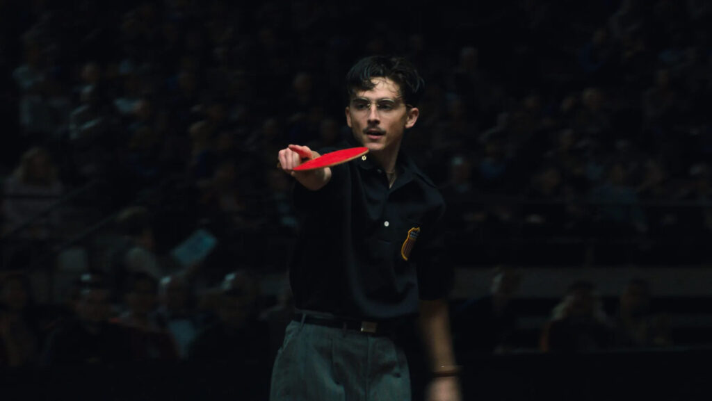 Timothée Chalamet poses in "Marty Supreme" (2025), a Christmas Day 2025 release. Image courtesy of A24.