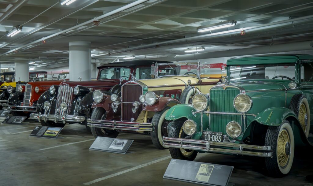 A lineup of vintage classics showcases the elegance of early design. Each placard tells a story of milestones and unique style. Photographed by Janwayne Orme/BruinLife.
