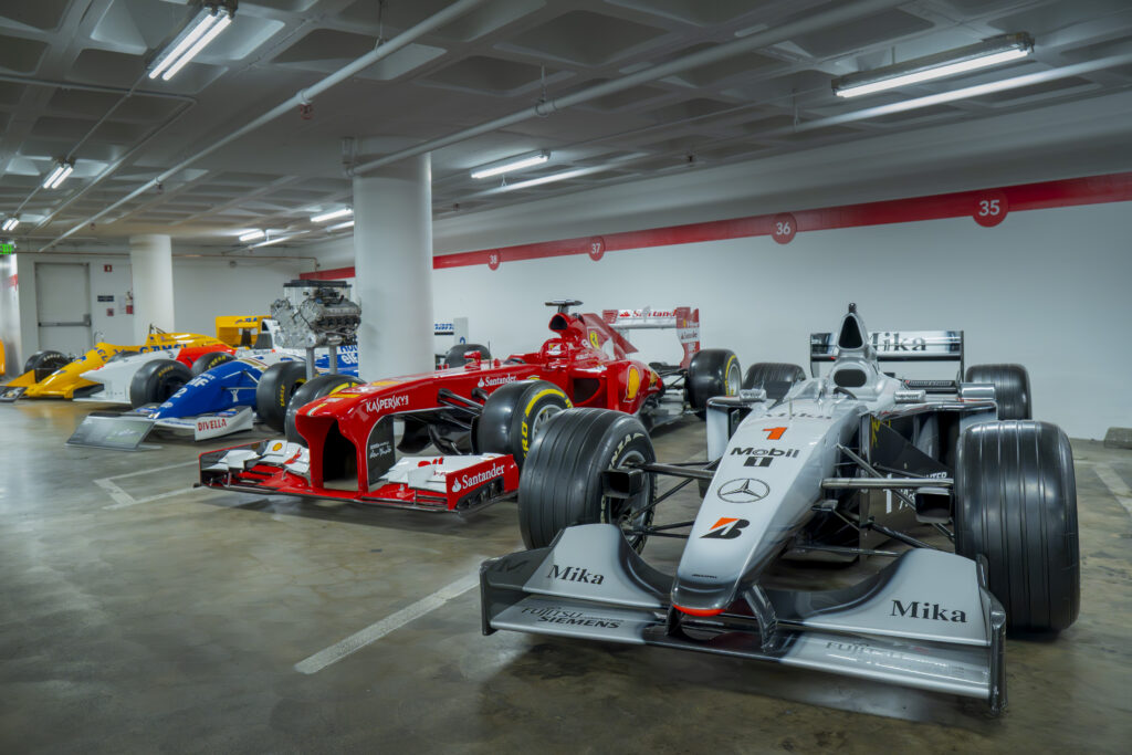 F1 cars sit side by side, echoing speed and rivalry. Each livery tells a story of battles and evolution. Photographed by Janwayne Orme/BruinLife.